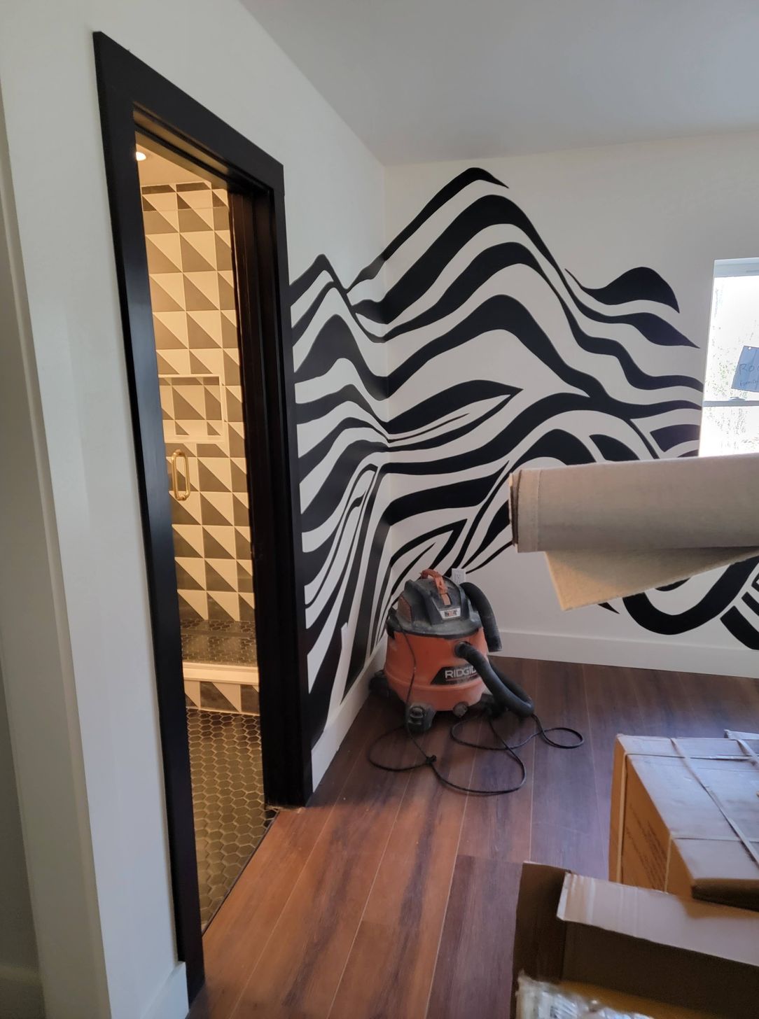 Home remodel interior with black and white mural during construction