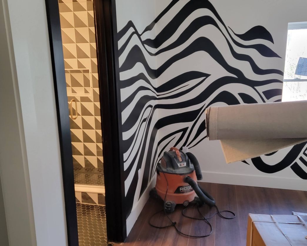 Blueprint Builders black and white remodeled interior with geometric bathroom tile
