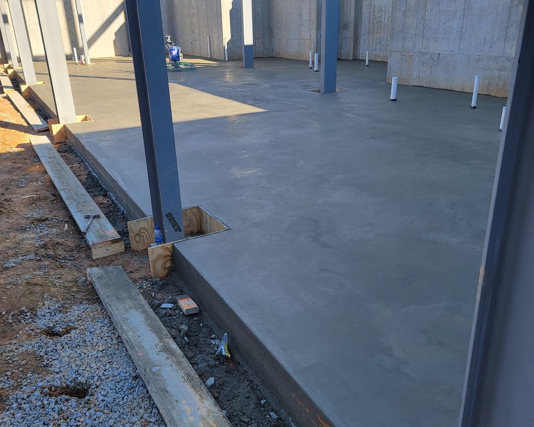 Blueprint Builders foundation slab and steel columns at a planning and feasibility stage site