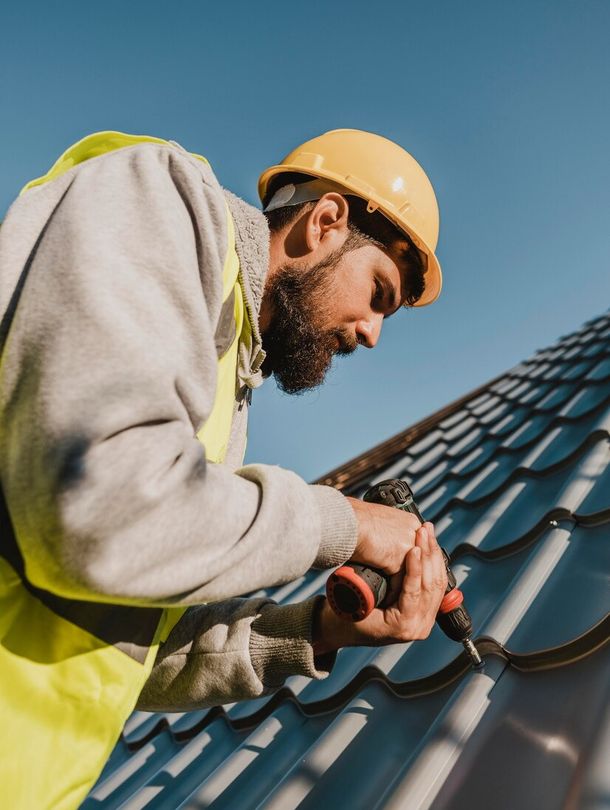 Man on roof conducting repairs